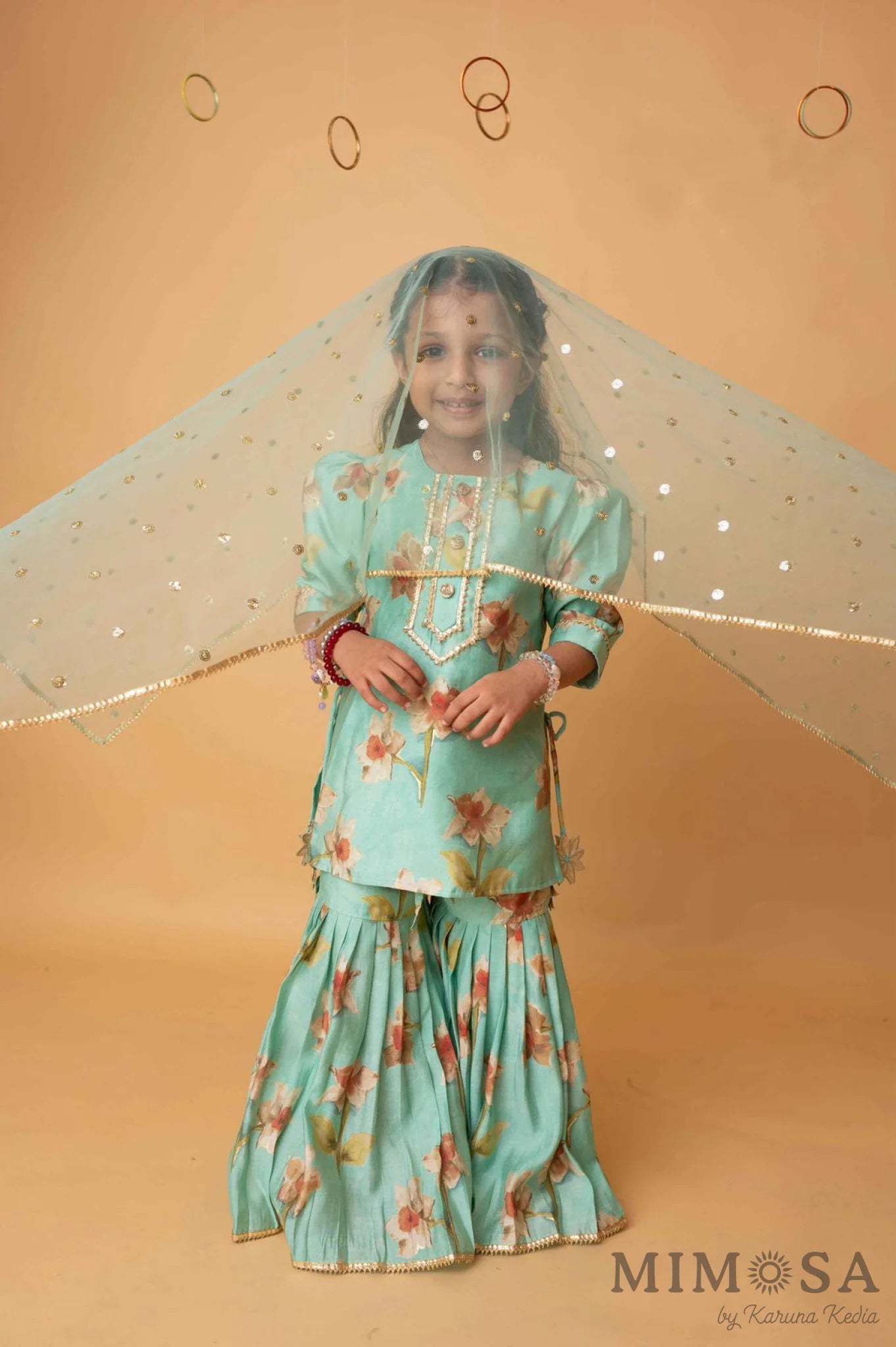 Sea green sharara set with sequinned net dupatta