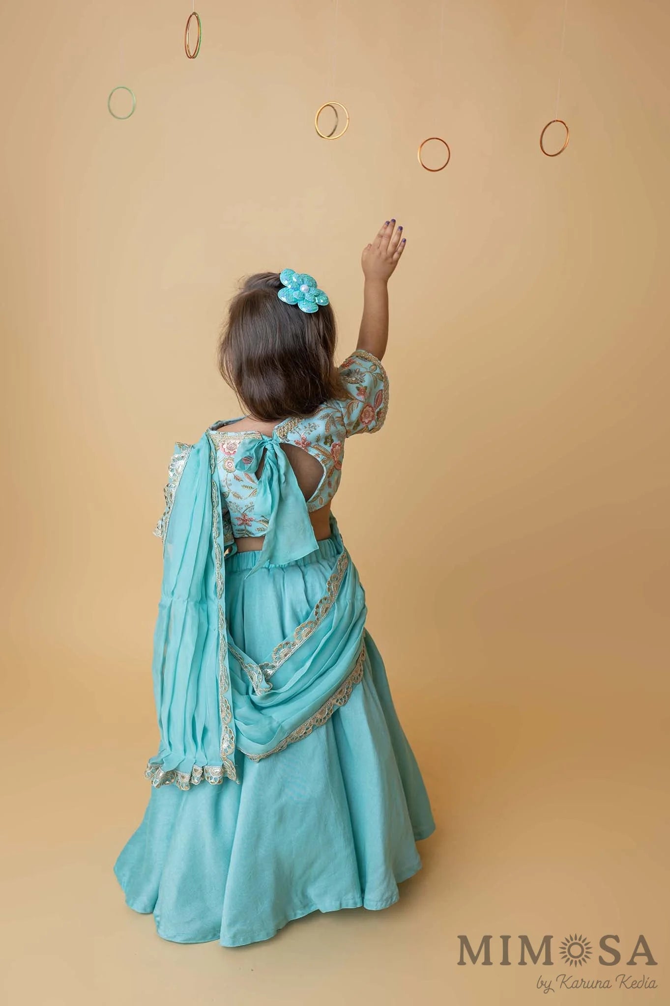 Teal lehenga with embroidered blouse and draped dupatta pallu