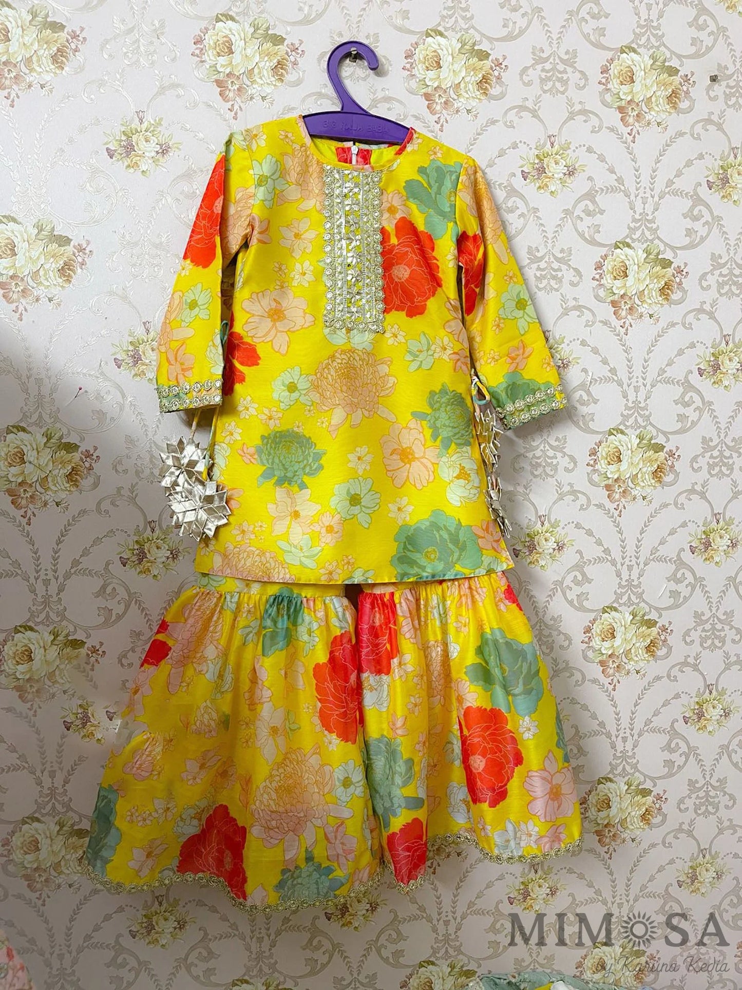 Vibrant floral print Sharara set with gota work and tassels comes with a net stole