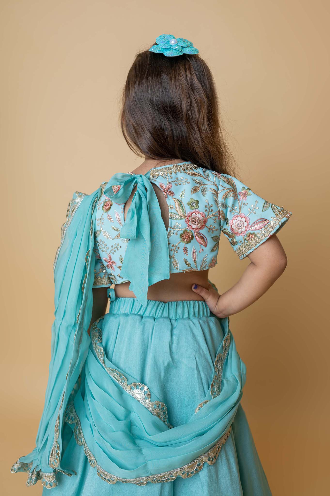 Teal lehenga with embroidered blouse and draped dupatta pallu