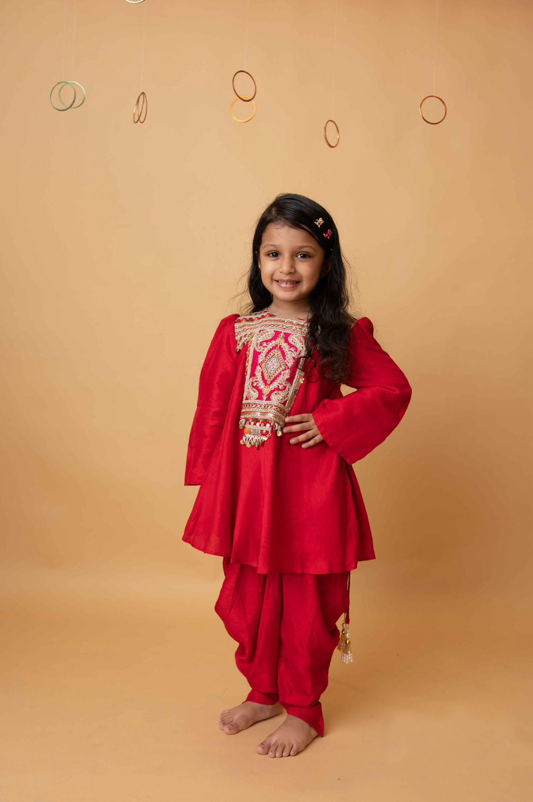 Frockstyle kurti with embroidered and embellished yoke paired with dhoti