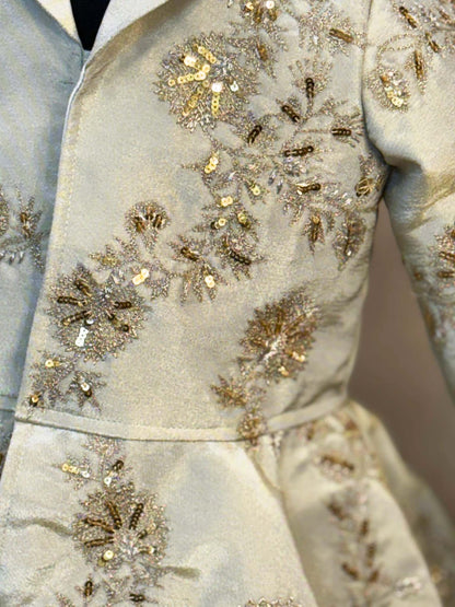 Peplum tissue jacket with hand work  and tissue full circle skirt with gota work tassels