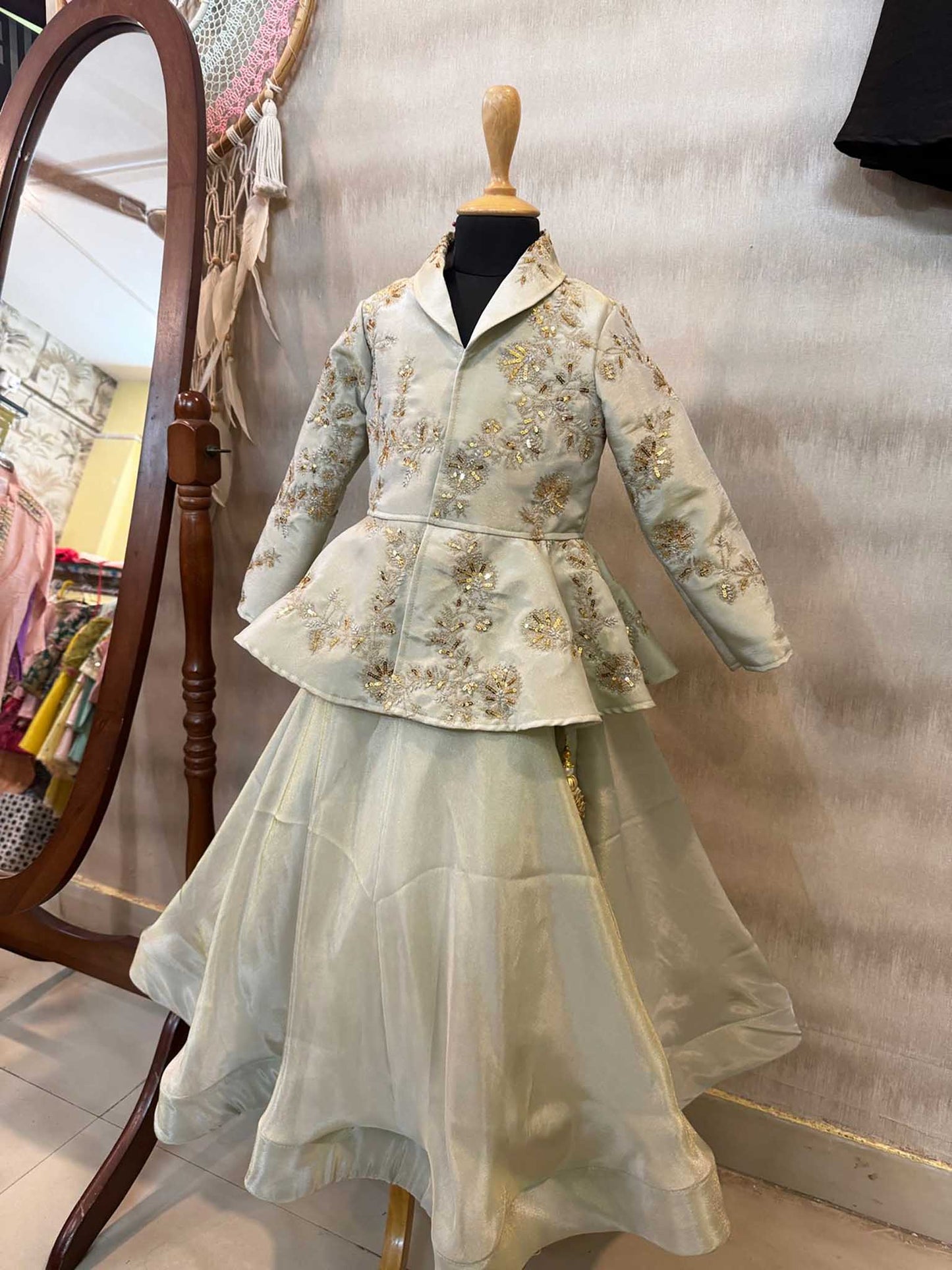 Peplum tissue jacket with hand work  and tissue full circle skirt with gota work tassels