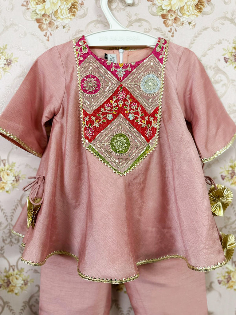 Embroidered yoke, tassel enhanced mustard kurti and pants