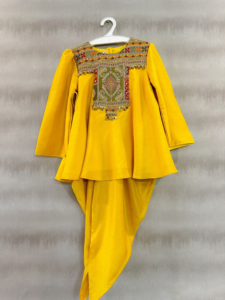 Frockstyle kurti with embroidered and embellished yoke paired with dhoti