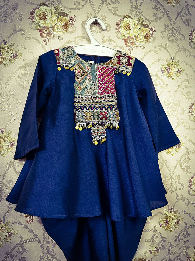 Frockstyle kurti with embroidered and embellished yoke paired with dhoti