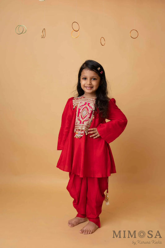 Frockstyle kurti with embroidered and embellished yoke paired with dhoti