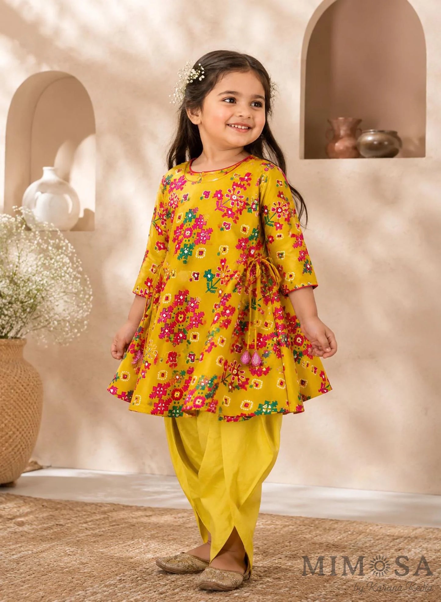 Pure Chanderi silk peplum top highlighted with mirror  work paired with tulip pants