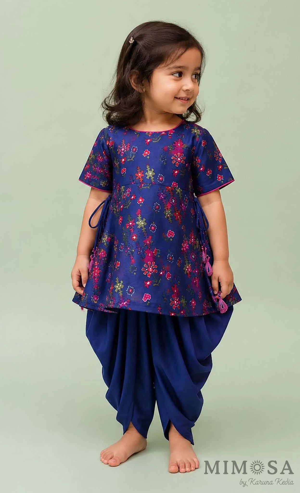 Pure Chanderi silk peplum top highlighted with mirror  work paired with tulip pants
