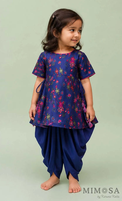Pure Chanderi silk peplum top highlighted with mirror  work paired with tulip pants