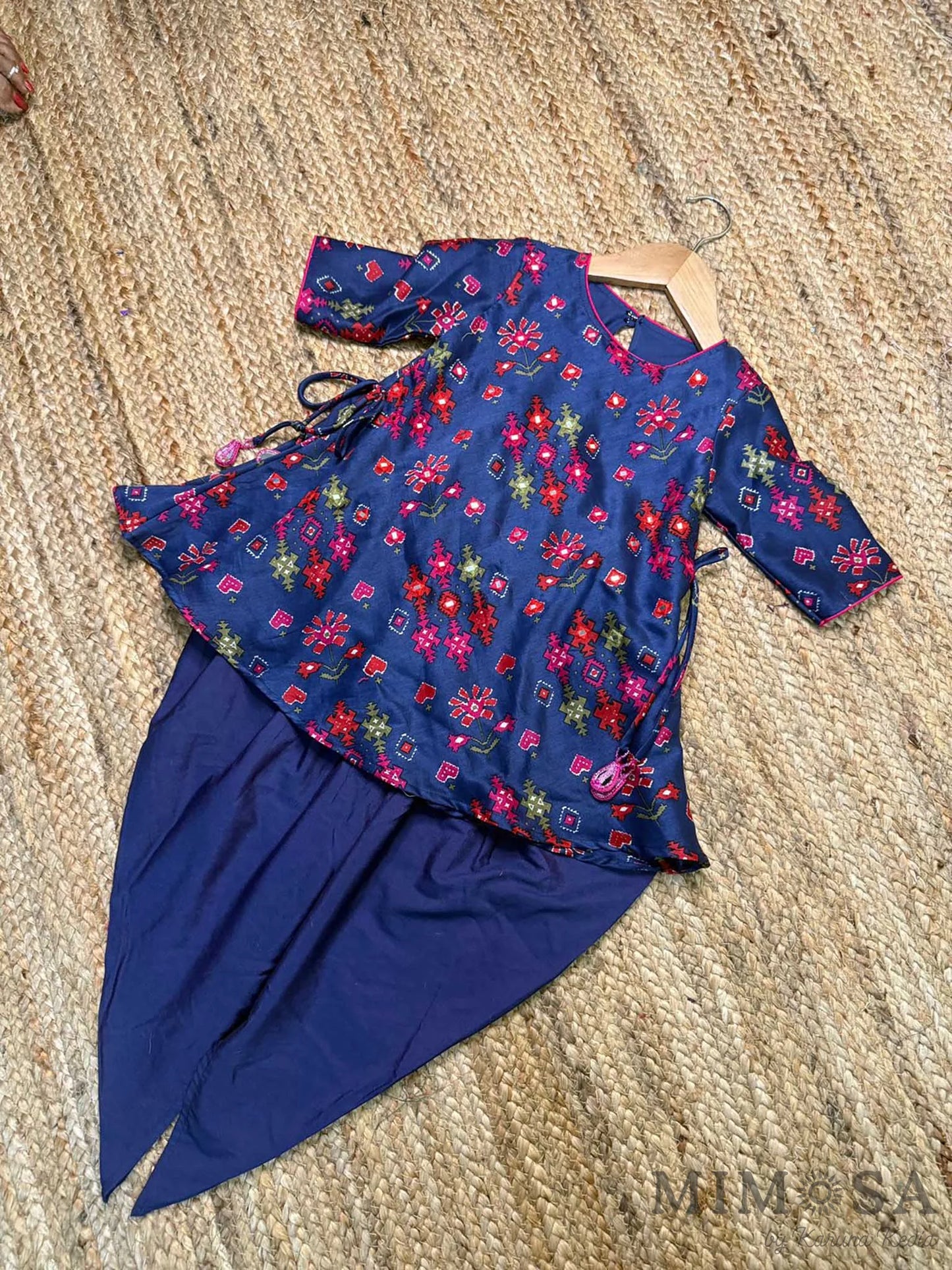 Pure Chanderi silk peplum top highlighted with mirror  work paired with tulip pants