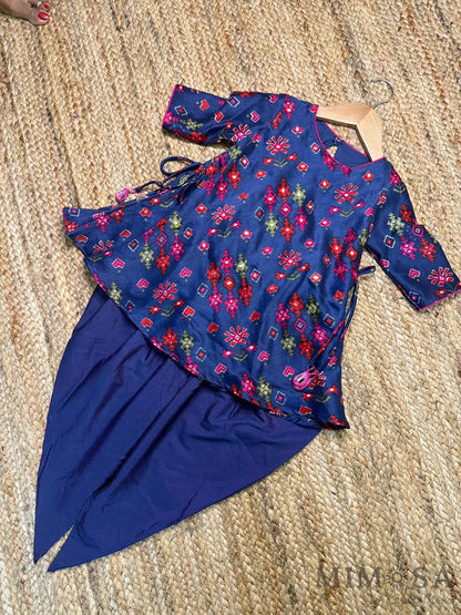Pure Chanderi silk peplum top highlighted with mirror  work paired with tulip pants