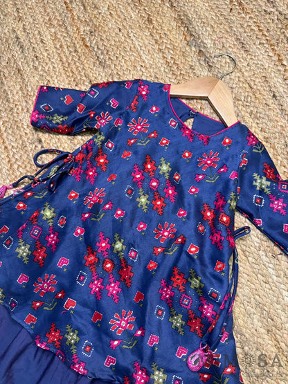 Pure Chanderi silk peplum top highlighted with mirror  work paired with tulip pants