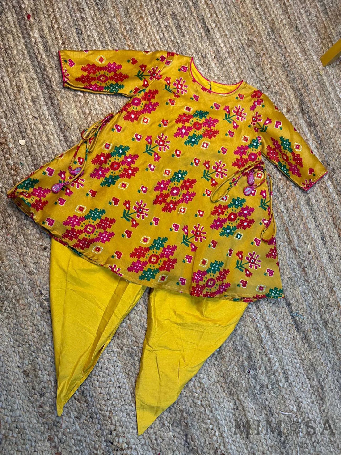 Pure Chanderi silk peplum top highlighted with mirror  work paired with tulip pants