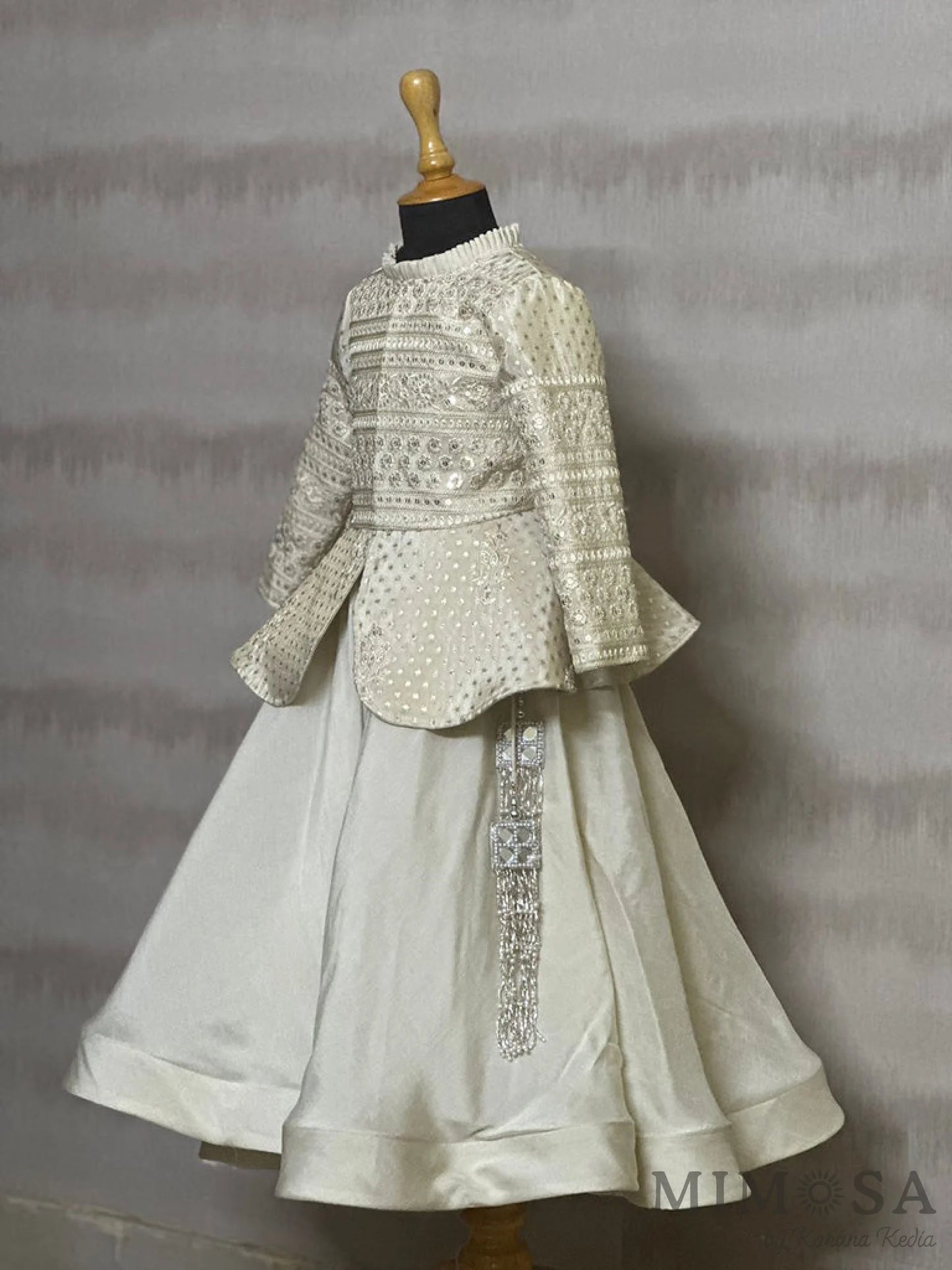 Tissue brocade, peplum blouse with Bamber silk skirt with tassels and organza Dupatta with allover buta